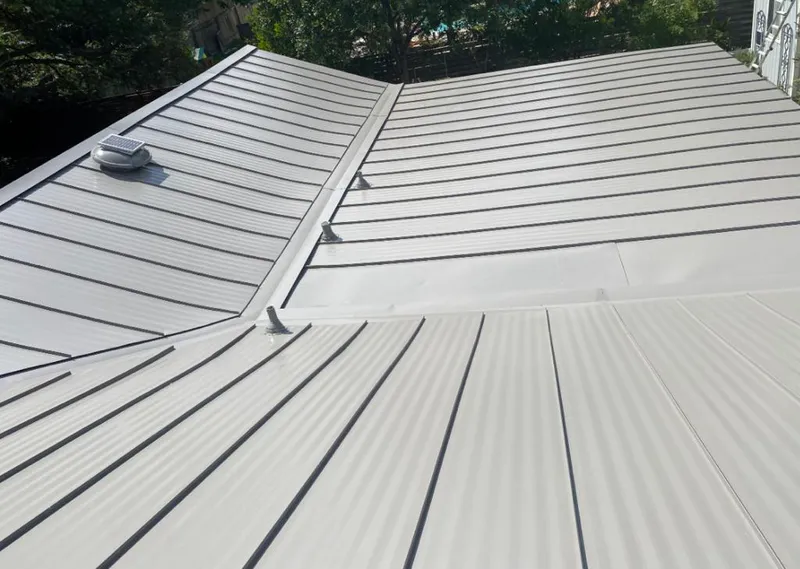 Solar attic fan installed on a metal roof for Roof Ventilation in Haines City